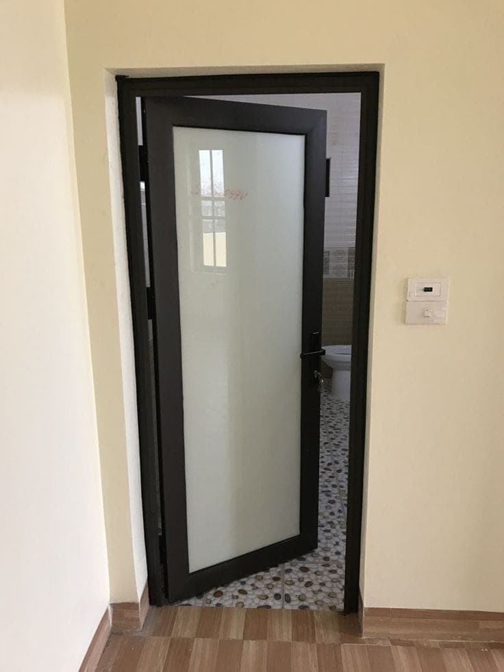 Black aluminium door with frosted glass