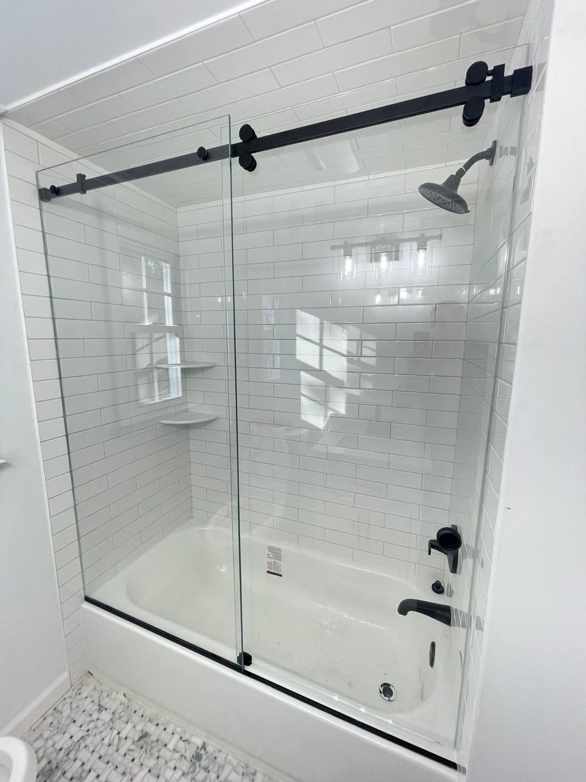 Sliding glass shower over bathtub