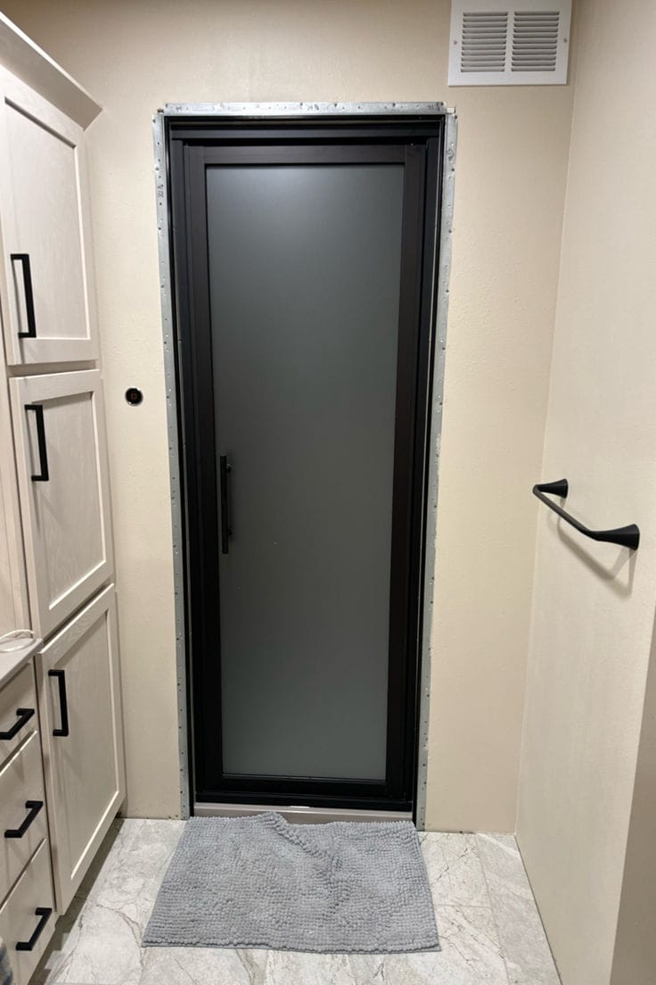 Black aluminium frosted door installation